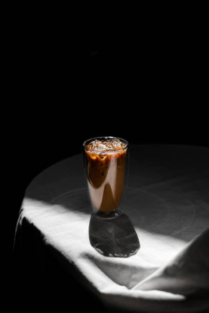 istock Glass of coffee on the table 1305230126