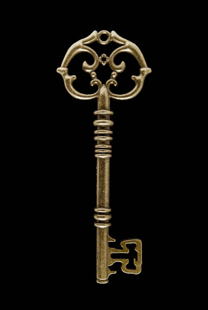 istock Key shapes making a abstract background using bronze antique keys 1305232414