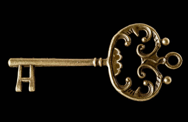 istock Key shapes making a abstract background using bronze antique keys 1305232416