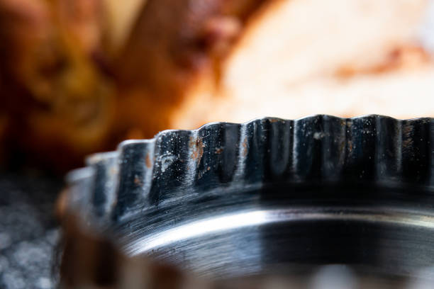 istock Baking pan with flour and bread residues on a table and a pan behind. 1305234317