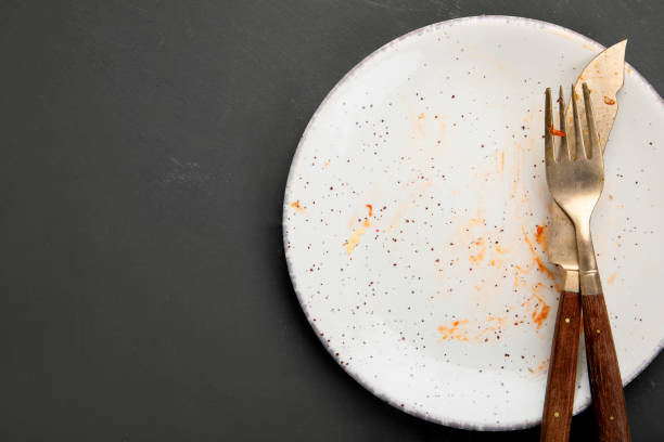 istock Pile of empty and dirty plates 1305234605
