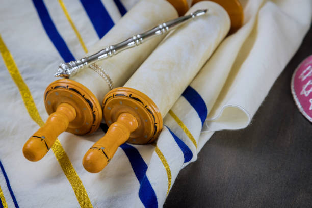 istock Jewish Orthodox holidays, during prayer items prayer shawl tallit with torah scroll 1305235471