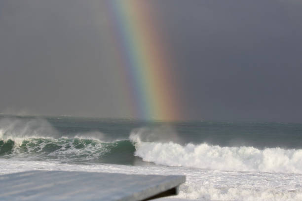 istock Rainbow in Japan at a beach called Hebara close to a large Surfing competition event. 1305238098