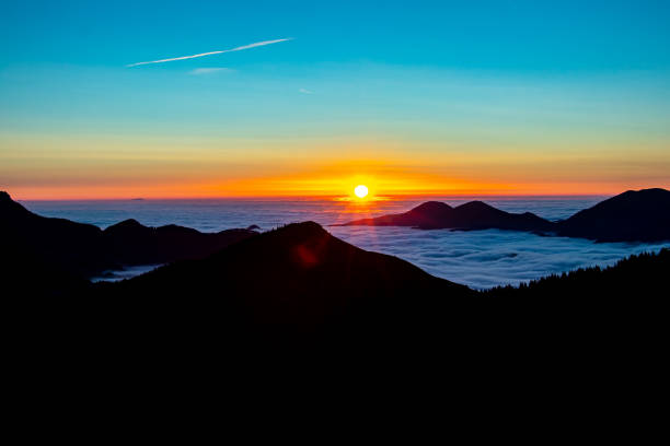 istock Sunrise with sea of clouds in horizon 1305241013