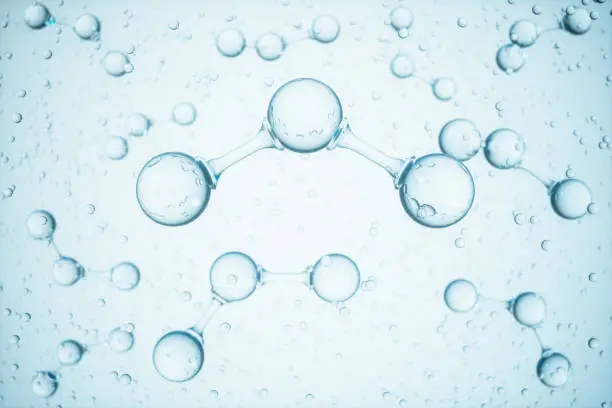 Photo of Molecular Structure Of Ozone With Transparent Bubbles And Blue Background.