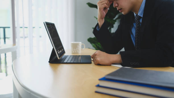 istock Frustrated businessman feeling tired from work and stressful while sitting in office. 1305242962