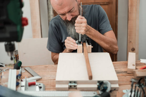 istock DIY woodworking, man gluing wood parts 1305244280