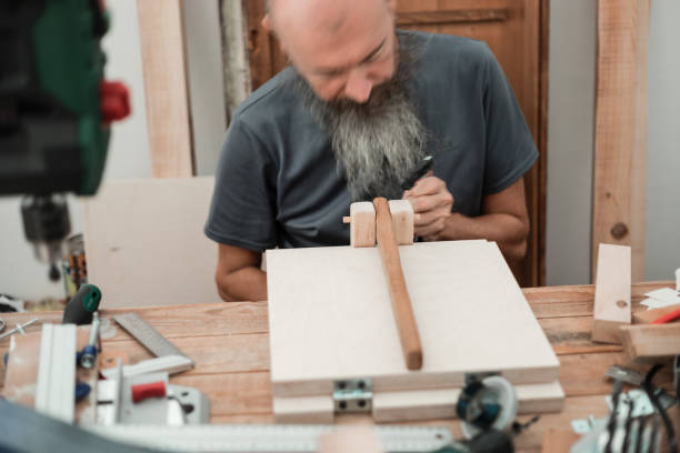 istock DIY woodworking, man gluing wood parts 1305244817
