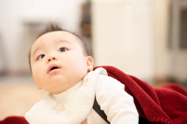 istock Baby crawling on the floor 1305244858