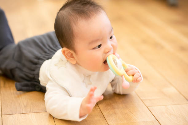 istock Baby crawling on the floor 1305245131