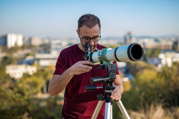istock Amateur astronomer looking at the sky with a telescope. 1305247055