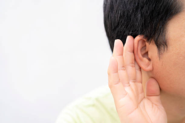 istock Hearing test showing ear of young man 1305247692