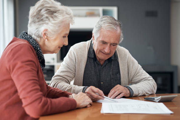 istock Reading the fine print on my investments 1305249877