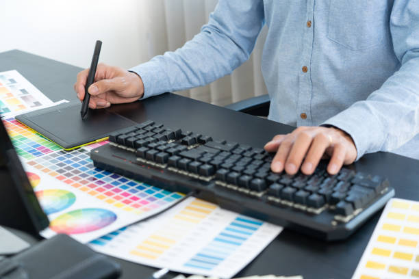 istock interior designer or creative graphic designer working on project architectural with colour samples with work tools and equipment for selection in office. 1305253647