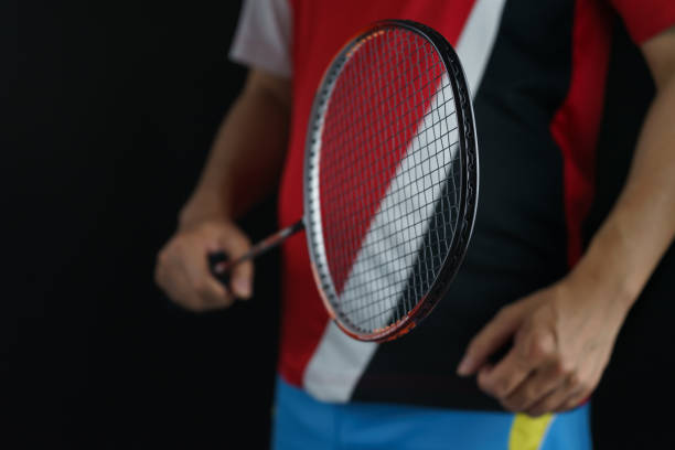 istock A badminton player postures receiving a badminton ball in a competition 1305254673