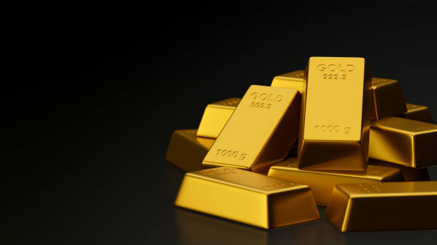 istock 3D rendering shiny gold bars stacked in black background with copy space 1305256665