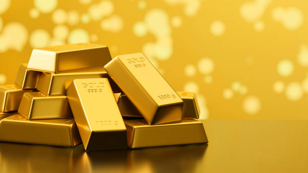 istock 3D rendering shiny gold bars stacked in bokeh background with copy space 1305256779