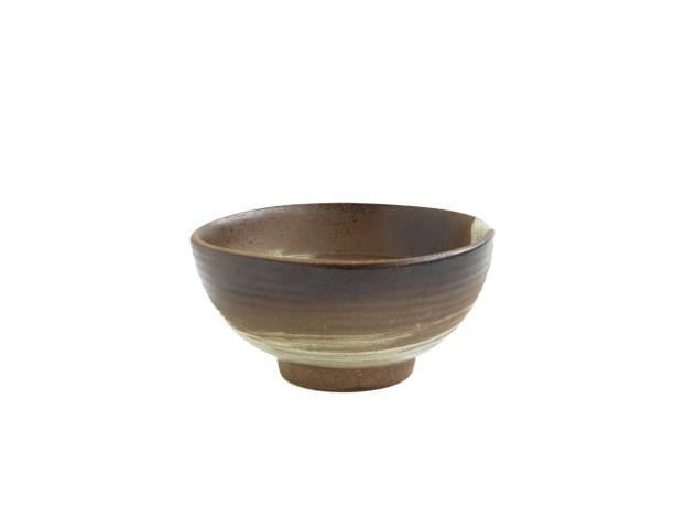 istock Empty old brown clay bowl with white stripe isolated on a white background. 1305258656