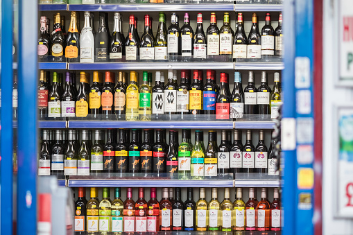 London, UK - 5 February, 2021 - A selection of wines displayed on shelf in an off-licence shop (liquor store) in Turnpike Lane