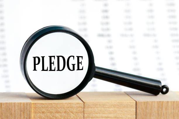 istock look closely and Pledge with a magnifying glass 1305264106