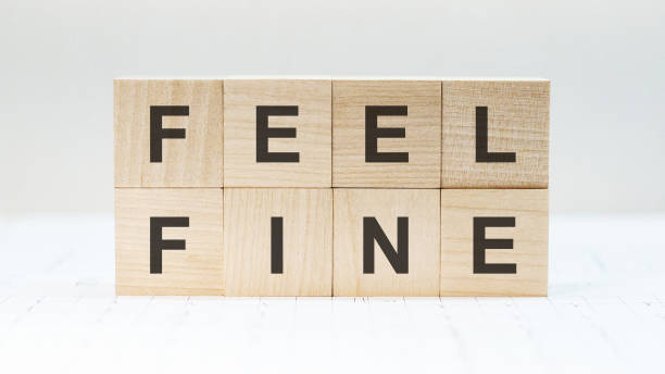 istock Feel Fine written on a wooden cube 1305264114