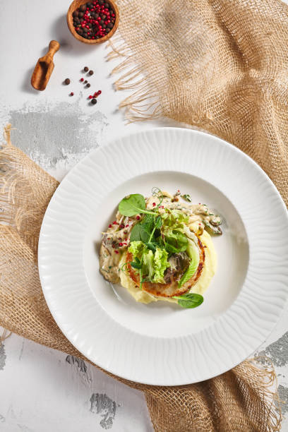 istock Mashed potatoes, mushrooms and rabbit cutlet. Restaurant food plate on white table. Delicious, healthy, organic dinner concept. 1305264187