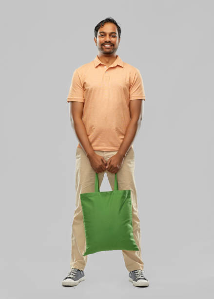 istock man with reusable canvas bag for food shopping 1305265169