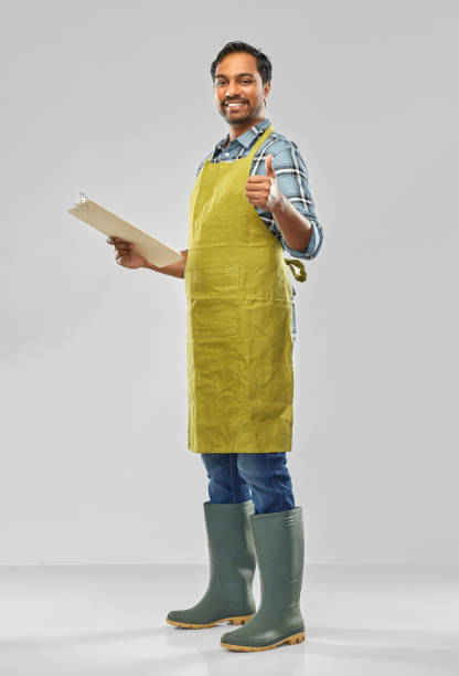 istock happy indian gardener or farmer with clipboard 1305265198