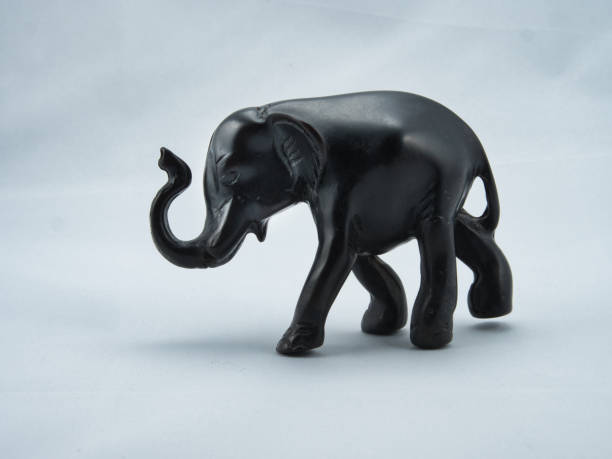istock Black Ebony Statue of Elephant on white background 1305265442