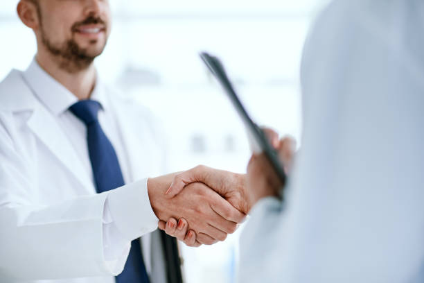 istock medical staff shaking hands. concept of cooperation 1305265449
