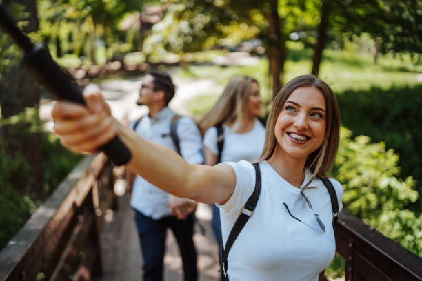 istock Young friends taking selfie in nature 1305265603