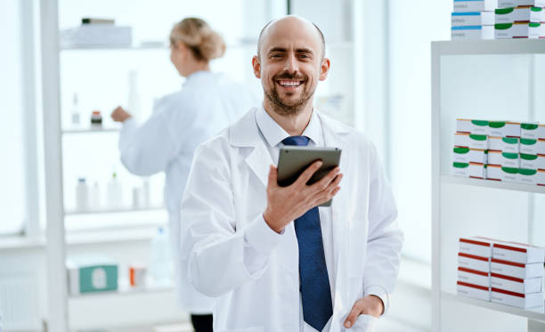 istock pharmacist with a digital tablet looking at you 1305265674