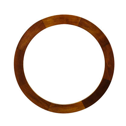 Clean wooden wheel from a cart used for decoration purposes isolated on a white background with clipping path at ALL sizes.