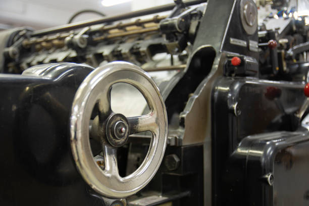 Printing press machine printing broadsheet newspapers in a printing plant.