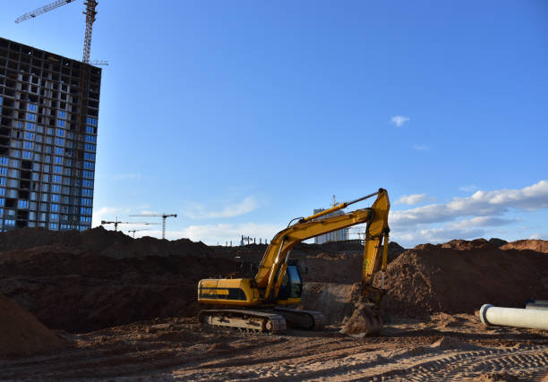 istock Excavator dig trench at construction site. Digging the pit foundation 1305266940