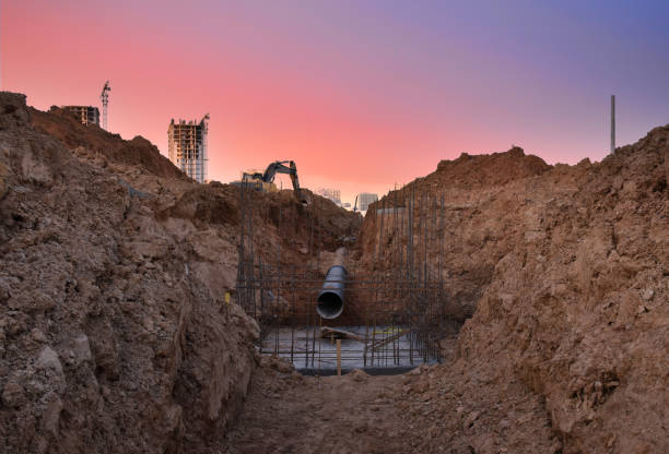 istock Trench for laying external sewer pipes. Sewage drainage system for a multi-story building 1305266941