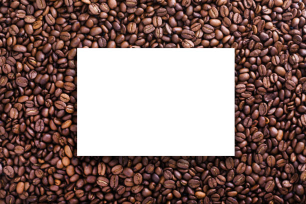 roasted beans background with coffee grains, white epmty board - epmty imagens e fotografias de stock