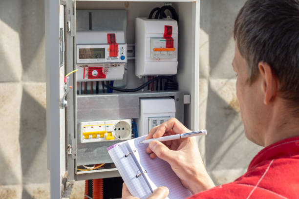 istock Man taking readings of an electric meter 1305268512