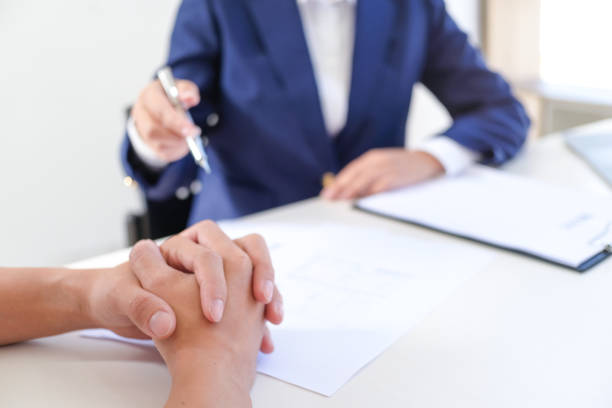istock Sales manager giving advice application form document, considering mortgage loan offer for car and house insurance. 1305268535
