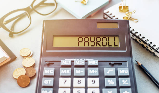 istock Payroll word written on calculator. Business and financial concept 1305269719