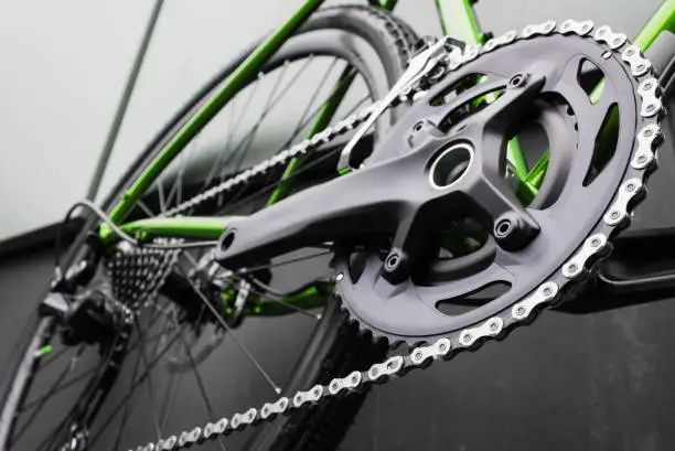 Close-up of the crankset of a new bike. Bicycle parts. Selective focus.