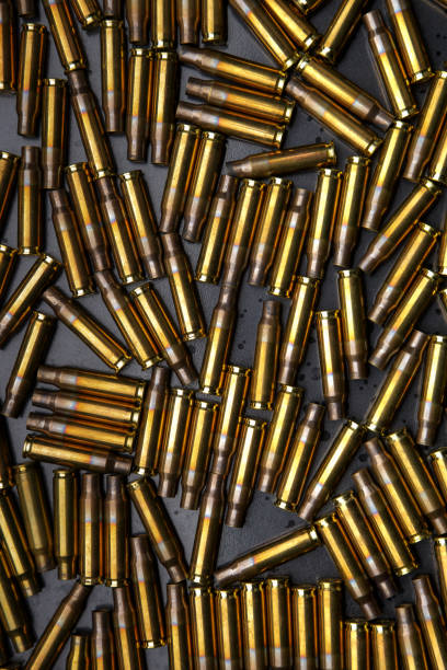 istock Background from empty used ammunition cases. Military background for poster or postcard. 1305273957