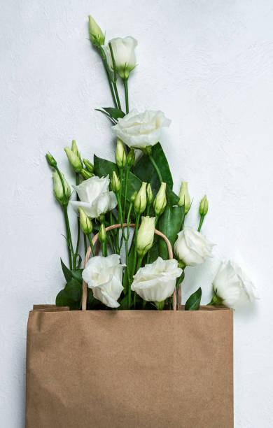 istock eustoma bouquet in paper bag 1305274831