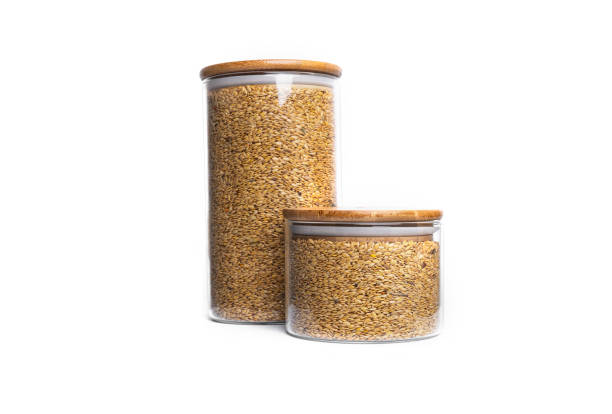 istock Flax seeds in a glass jar isolated on a white background 1305275195