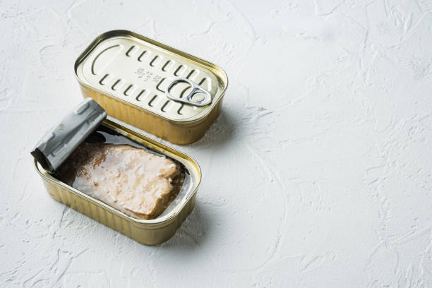 istock Canned wild Trout, in tin can, on white background, with copyspace  and space for text 1305275377