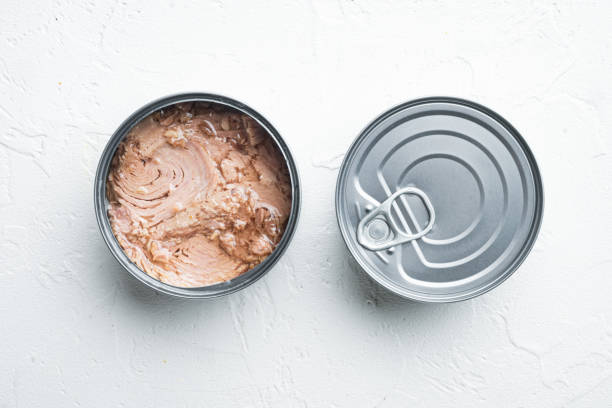 istock Canned Albacore Wild Tuna, in tin can, on white background, top view flat lay 1305276384