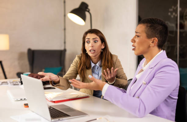 istock Two female colleagues arguing indoors 1305278098