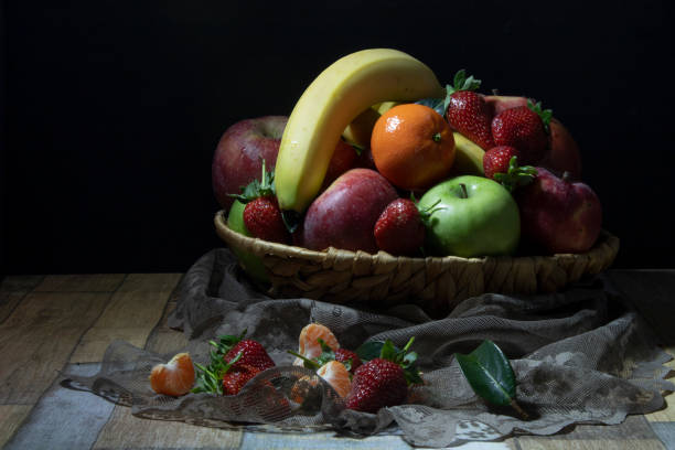 Still life with winter berries on rustic wooden background