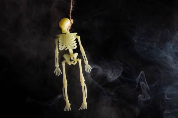 istock hanged skeleton on a black background in smoke 1305283449