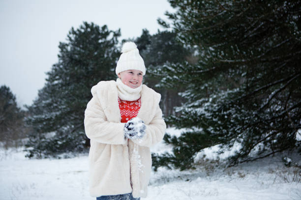 istock Young girl outside in the snow 1305283514
